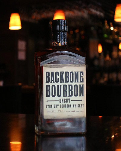 Backbone Bourbon Uncut Bottle sitting in bar